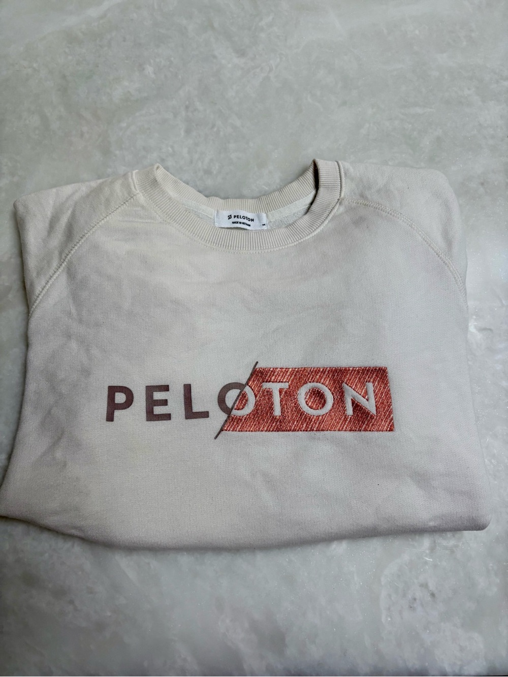 Peloton Cream Sweatshirt with Rust Logo